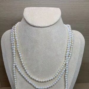 Strand of long mini moon pearls
